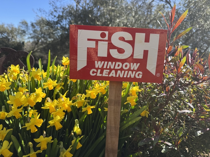 Fish Window Cleaning yard sign outside a customer property