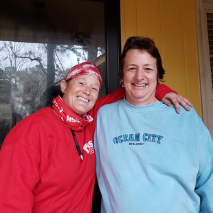 Fish Window Cleaner with Recipient of Free Window Cleaning for Breast Cancer Awareness Month