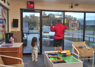 Little Girl Watching Fish Window Cleaner Clean Storefront Window