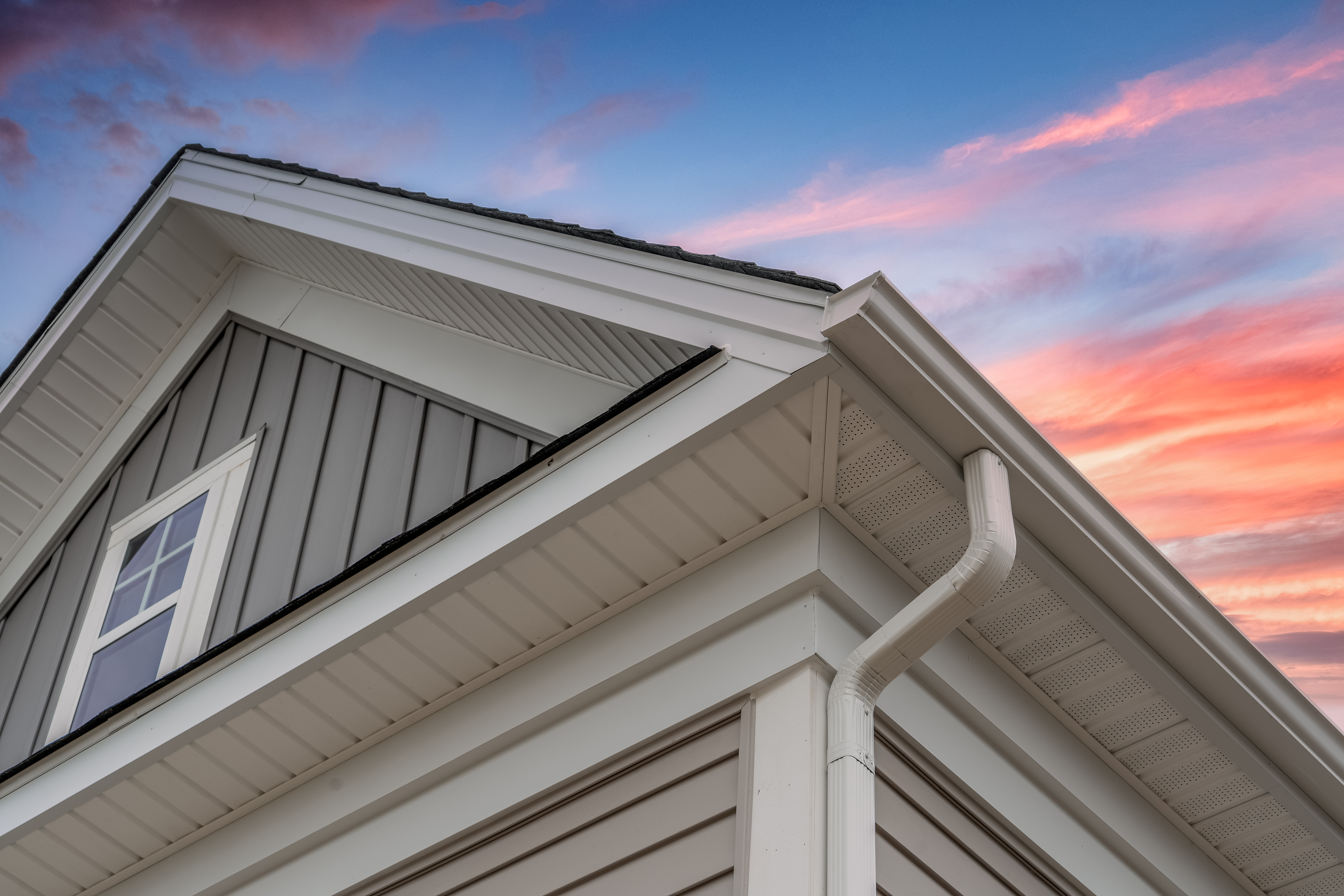 Corner of Gutter on Gray Sided 2-Story Home