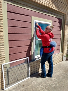 Window Cleaner Cleaning Window of a Killeen TX Health Clinic