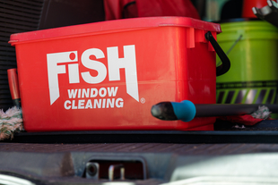 Image of Red Bucket with Fish Window Cleaning Logo