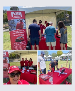 fish employees at their tent booth